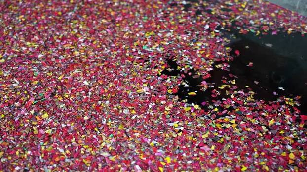 View of red chili flakes drying on a dark surface Bangladesh. View of red chili flakes drying on a dark surface Bangladesh.