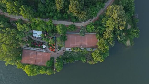 Aerial view of tennis courts and park by the lake in Tirane Albania. Aerial view of tennis courts and park by the lake in Tirane Albania.