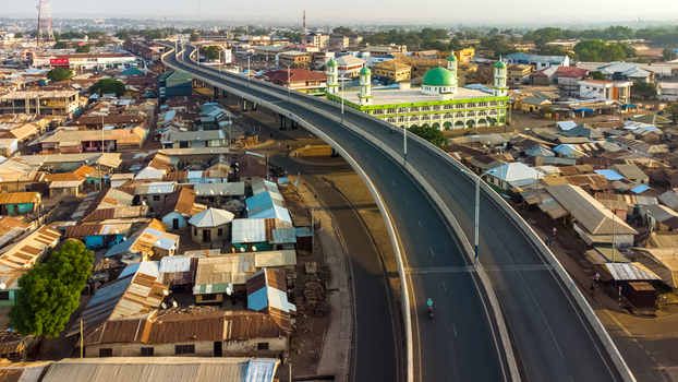 Aerial view of Tamale Central Mosque situated near the elevated highway in the urban landscape of Tamale Northern Region Ghana. Aerial view of Tamale Central Mosque situated near the elevated highway in the urban landscape of Tamale Northern Region Ghana.