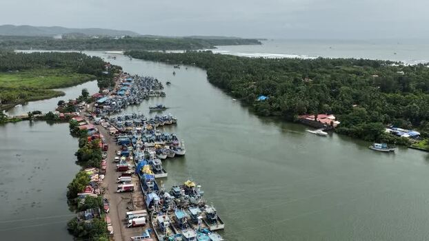 Aerial view of Cutbona Fishing Jetty and docked boats India.
