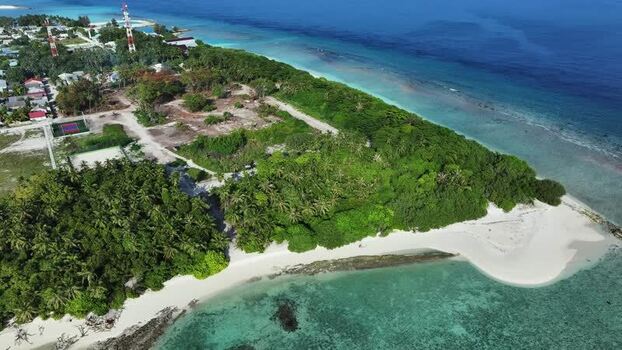 Aerial view of the tropical island of Naavaidhoo Maldives. Aerial view of the tropical island of Naavaidhoo Maldives.
