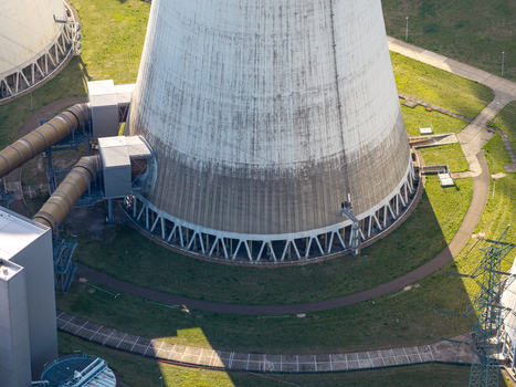 Aerial view of the Janschwalde Power Station cooling tower with industrial piping and surrounding green landscape in Peitz Brandenburg Germany. Aerial view of the Janschwalde Power Station cooling tower with industrial piping and surrounding green landscape in Peitz Brandenburg Germany.