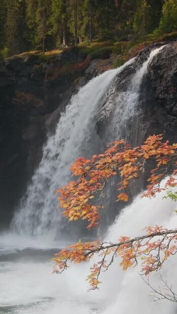 View of Rjukandefoss waterfall in autumn Norway.