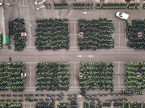 Middenmeer Netherlands 15 June 2026 Aerial view of thousands of GO Sharing electric scooters parked in dense blocks at a depot in Agriport after the company s business failure.