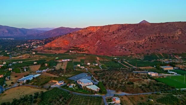 Aerial view of Crete landscape with building complex Greece.
