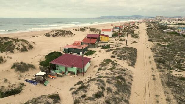 Aerial view of colorful beach houses at Praia da Mata Portugal. Aerial view of colorful beach houses at Praia da Mata Portugal.