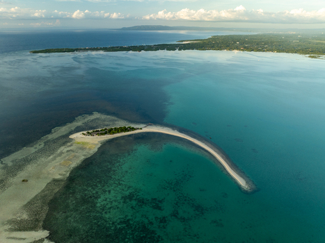 Aerial view of Pungtud sandbank surrounded by turquoise waters and coral reefs in Panglao Philippines. Aerial view of Pungtud sandbank surrounded by turquoise waters and coral reefs in Panglao Philippines.