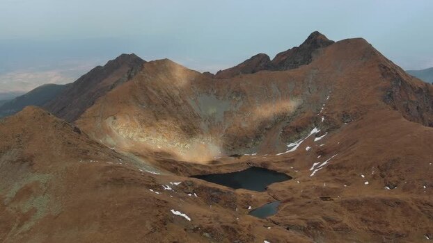 Aerial view of Transfagarasan mountain peaks in Romania. Aerial view of Transfagarasan mountain peaks in Romania.