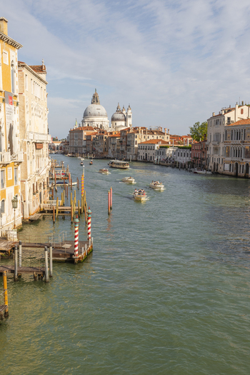 Venice Italy 21 September 2026 View of the Grand Canal with boats navigating towards the Basilica di Santa Maria della Salute framed by historic Venetian architecture. Venice Italy 21 September 2026 View of the Grand Canal with boats navigating towards the Basilica di Santa Maria della Salute framed by historic Venetian architecture.