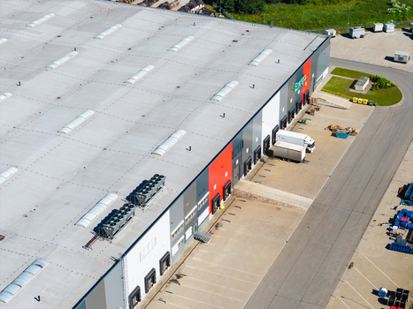Lielvarzi Latvia 05 July 2026 Aerial view of VGP Park Kekava warehouse featuring multiple loading docks parked semi trucks and a large industrial facility. Lielvarzi Latvia 05 July 2026 Aerial view of VGP Park Kekava warehouse featuring multiple loading docks parked semi trucks and a large industrial facility.