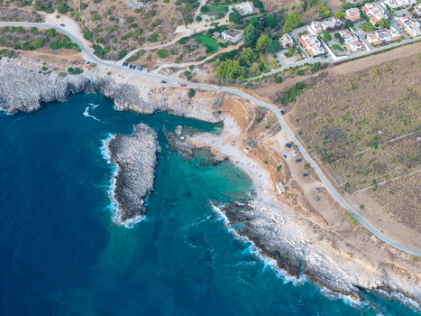 Aerial view of Riserva Naturale Orientata dello Zingaro with turquoise water rocky coastline and coastal road in San Vito Lo Capo Sicilia Italy. Aerial view of Riserva Naturale Orientata dello Zingaro with turquoise water rocky coastline and coastal road in San Vito Lo Capo Sicilia Italy.