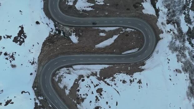 Aerial view of Julierpass road with vehicles Switzerland. Aerial view of Julierpass road with vehicles Switzerland.