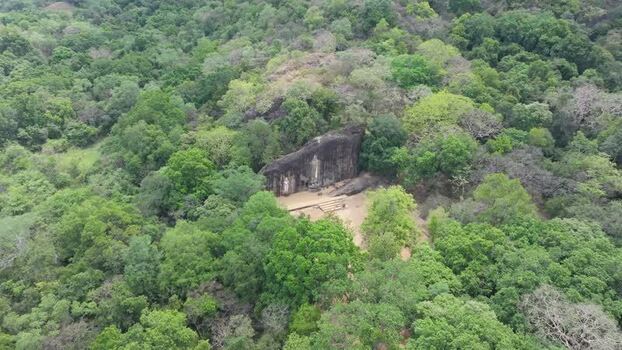Aerial view of ancient rock temple in forest Sri Lanka.