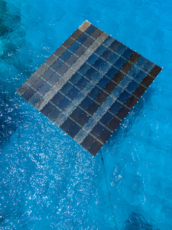 Aerial view of SolarSea floating solar power plant by Swimsol on turquoise ocean water in Dharavandhoo Baa Atoll Maldives. Aerial view of SolarSea floating solar power plant by Swimsol on turquoise ocean water in Dharavandhoo Baa Atoll Maldives.