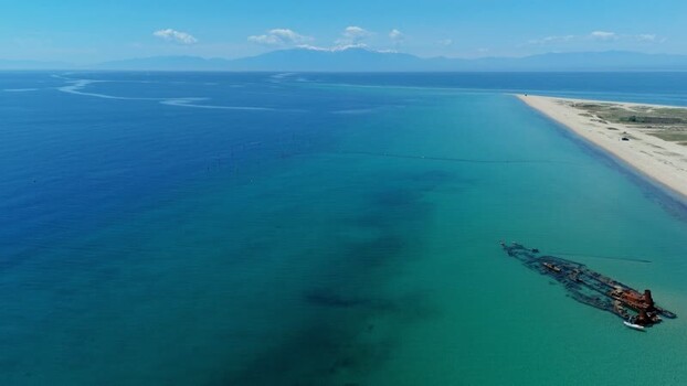 Aerial view of the Shipwreck Epanomi in turquoise waters Greece.