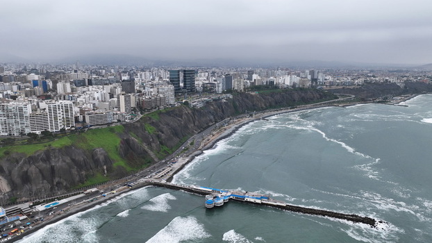 Aerial view of the coastal cliffs and modern skyline of Miraflores overlooking the Pacific Ocean in the Barranco district Barranco Provincia de Lima Peru. Aerial view of the coastal cliffs and modern skyline of Miraflores overlooking the Pacific Ocean in the Barranco district Barranco Provincia de Lima Peru.