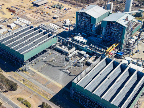 Aerial view of Millmerran Power Station featuring large industrial buildings cooling towers and complex infrastructure in a rural landscape in Domville Queensland Australia. Aerial view of Millmerran Power Station featuring large industrial buildings cooling towers and complex infrastructure in a rural landscape in Domville Queensland Australia.