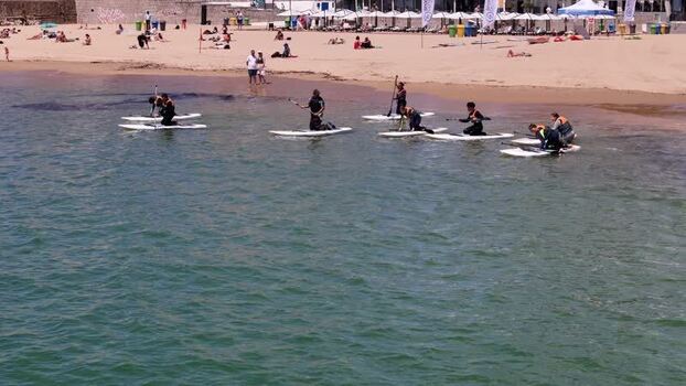 Aerial view of people on paddleboards near the beach Portugal.