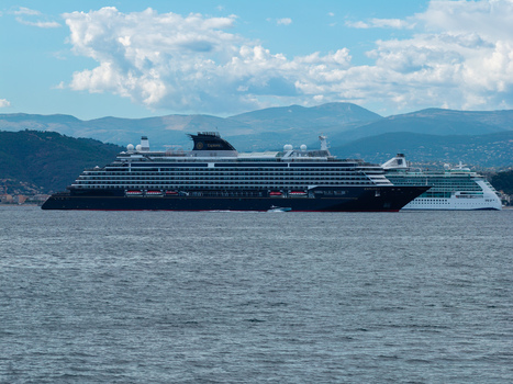 Aerial view of two large cruise ships sailing on the Mediterranean Sea near the coast with mountains in the background in Cannes Provence Alpes Cote d Azur France. Aerial view of two large cruise ships sailing on the Mediterranean Sea near the coast with mountains in the background in Cannes Provence Alpes Cote d Azur France.