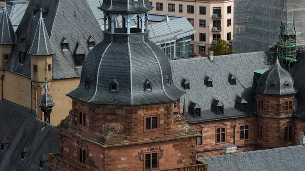 Aerial view of Schloss Johannisburg with its distinctive red sandstone architecture slate roofs and towers in Aschaffenburg Bayern Germany.