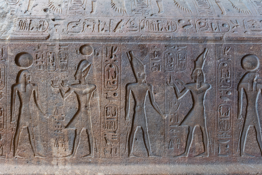 Giza Egypt 16 May 2026 View of ancient Egyptian hieroglyphs and relief carvings on a stone sarcophagus at the Grand Egyptian Museum.