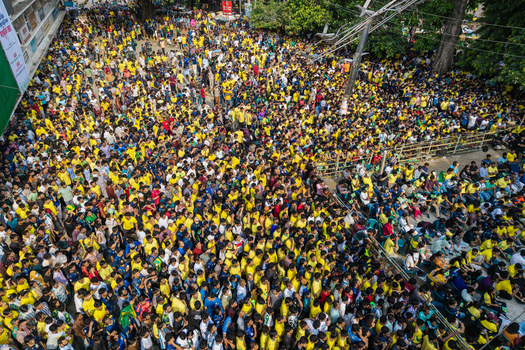 Dhaka Bangladesh 20 June 2026 Aerial view of a large crowd of people wearing yellow shirts gathered at Dhaka University Campus. Dhaka Bangladesh 20 June 2026 Aerial view of a large crowd of people wearing yellow shirts gathered at Dhaka University Campus.