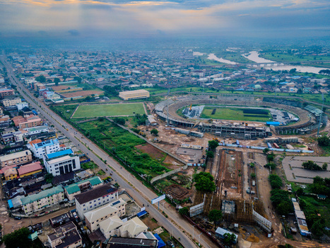 Aerial view of Ahmadu Bello Stadium surrounded by urban buildings roads and greenery in Kaduna Kaduna Nigeria. Aerial view of Ahmadu Bello Stadium surrounded by urban buildings roads and greenery in Kaduna Kaduna Nigeria.