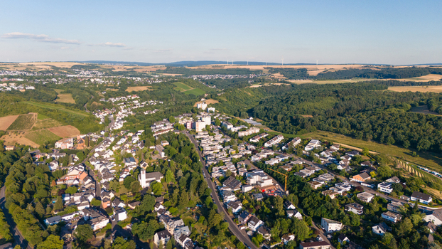 Aerial view of the city of Trier surrounded by lush green vineyards and rolling hills in the Moselle valley Rhineland Palatinate Germany. Aerial view of the city of Trier surrounded by lush green vineyards and rolling hills in the Moselle valley Rhineland Palatinate Germany.
