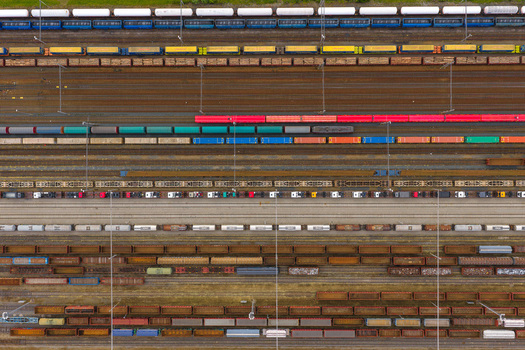 Aerial view of colorful freight trains and wagons on multiple tracks in a railway yard in Breclav South Moravian Region Czechia.