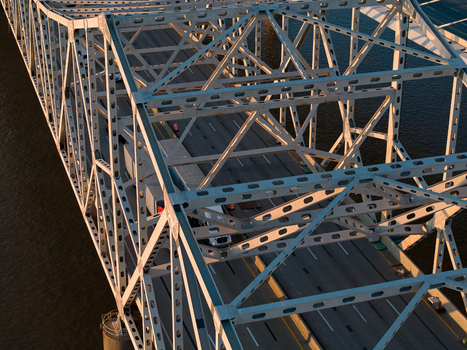 Aerial view of the George Rogers Clark Memorial Bridge showing the intricate steel truss structure and roadway over the Ohio River in Louisville Kentucky United States. Aerial view of the George Rogers Clark Memorial Bridge showing the intricate steel truss structure and roadway over the Ohio River in Louisville Kentucky United States.