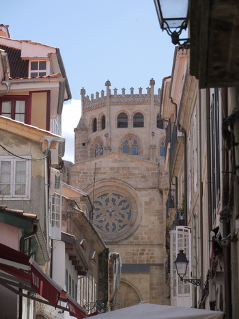 View of the historic Catedral de Ourense framed by narrow stone streets and traditional buildings in Ourense Ourense Spain. View of the historic Catedral de Ourense framed by narrow stone streets and traditional buildings in Ourense Ourense Spain.