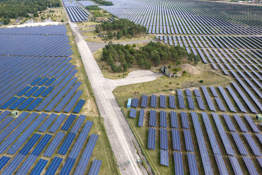 Aerial view of the solar field at the former military airfield in Preschen with rows of solar panels covering the historic runway and taxiway in Neisse Malxetal Brandenburg Germany. Aerial view of the solar field at the former military airfield in Preschen with rows of solar panels covering the historic runway and taxiway in Neisse Malxetal Brandenburg Germany.