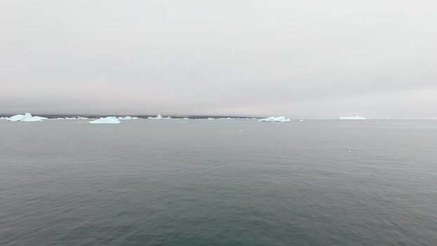 Aerial view of icebergs floating in Disko Bugt Greenland. Aerial view of icebergs floating in Disko Bugt Greenland.