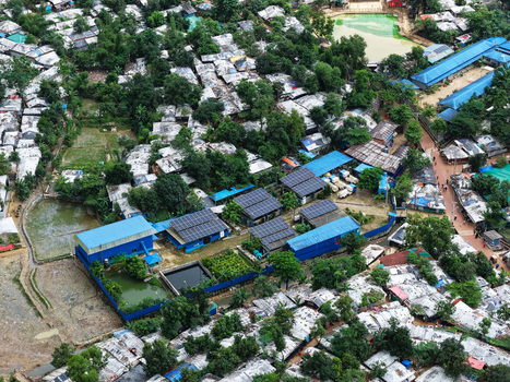 Aerial view of Camp 7 Kutupalang Expansion Sites showing dense shelters blue roofed buildings with solar panels and small ponds Cox s Bazar District Chittagong Division Bangladesh.