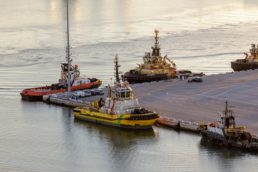 Aerial view of tugboats moored at the Ancona Port pier during golden hour in Ancona Marche Italy. Aerial view of tugboats moored at the Ancona Port pier during golden hour in Ancona Marche Italy.