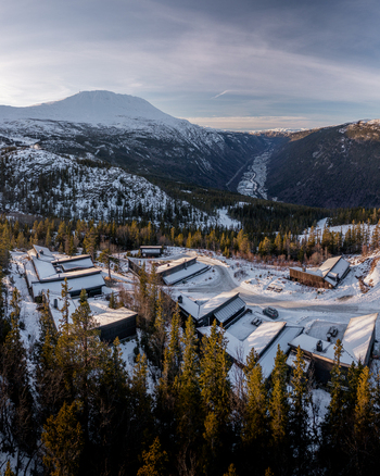 Aerial view of Gaustablikk Fjellresort nestled in a snowy mountain landscape with pine forests and a valley in the background Rjukan Telemark Norway. Aerial view of Gaustablikk Fjellresort nestled in a snowy mountain landscape with pine forests and a valley in the background Rjukan Telemark Norway.