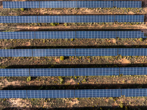 Aerial view of rows of solar panels arranged in a desert landscape Colorado United States. Aerial view of rows of solar panels arranged in a desert landscape Colorado United States.