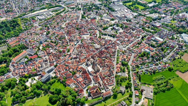 Aerial view of the historic old town of Forchheim featuring traditional red tiled rooftops the central parish church and lush green parks in Forchheim Bavaria Germany. Aerial view of the historic old town of Forchheim featuring traditional red tiled rooftops the central parish church and lush green parks in Forchheim Bavaria Germany.