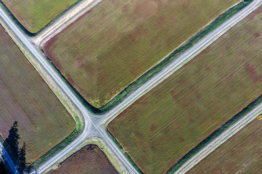 Aerial view of cranberry bogs with geometric patterns and intersecting dirt roads in Bandon Oregon United States. Aerial view of cranberry bogs with geometric patterns and intersecting dirt roads in Bandon Oregon United States.