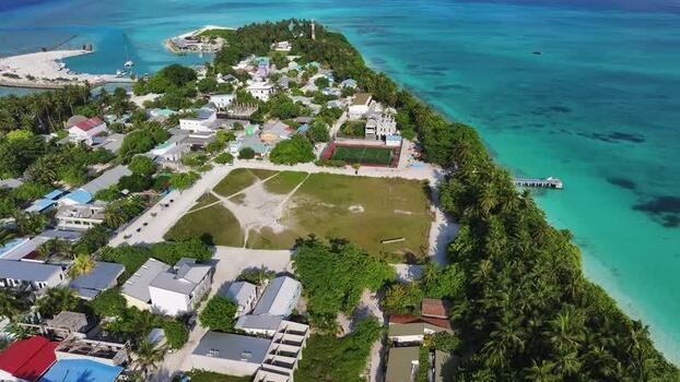 Aerial view of Fulhadhoo island village and coast Maldives.
