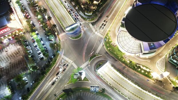 Kecamatan Kebayoran Lama Daerah Khusus Ibukota Indonesia 22 September 2022 Aerial view of Pondok Indah Mall 2 at night with illuminated roads and light trails from traffic. Kecamatan Kebayoran Lama Daerah Khusus Ibukota Indonesia 22 September 2022 Aerial view of Pondok Indah Mall 2 at night with illuminated roads and light trails from traffic.