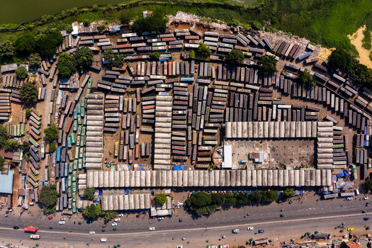 Aerial view of Gabtoli Bus Terminal with rows of parked buses and terminal buildings in an urban setting in Dhaka Dhaka Division Bangladesh.