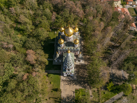 Aerial view of Shipka Memorial Church with its distinctive golden domes surrounded by lush forest in Shipka Stara Zagora Bulgaria. Aerial view of Shipka Memorial Church with its distinctive golden domes surrounded by lush forest in Shipka Stara Zagora Bulgaria.