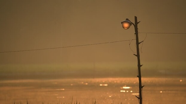 View of a street lamp at sunset Bangladesh.