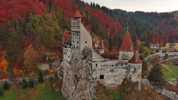 Aerial view of Bran Castle in the autumn forest Romania. Aerial view of Bran Castle in the autumn forest Romania.