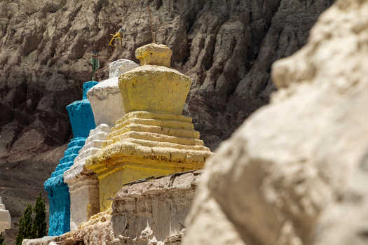 View of Charasa Gonpa featuring colorful stupas set against a rugged mountain landscape in Charasa Ladakh India.