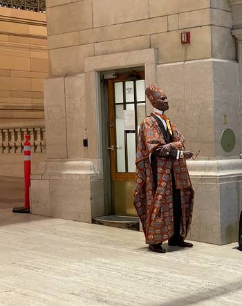 New York United States 14 May 2026 View of a man in traditional African attire standing near a doorway inside the historic Grand Central Terminal.