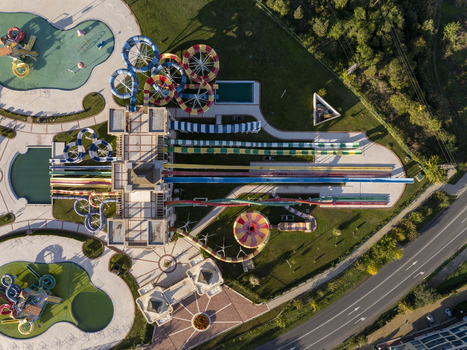 Aerial view of a water park with colorful slides swimming pools and surrounding green areas in Bulgaria. Aerial view of a water park with colorful slides swimming pools and surrounding green areas in Bulgaria.