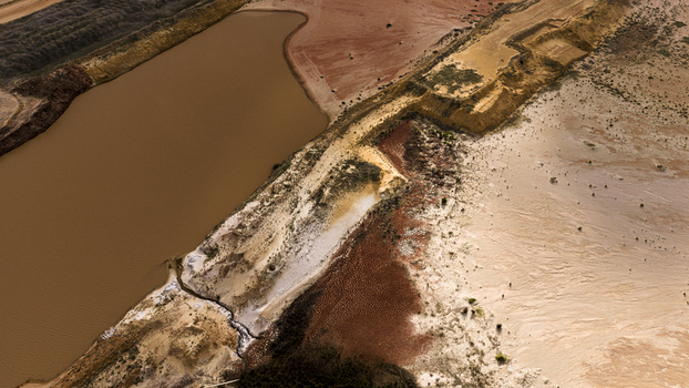Aerial view of industrial salt mining patterns and sediment rich water channels flowing through sandy terrain Kalbarri Western Australia Australia. Aerial view of industrial salt mining patterns and sediment rich water channels flowing through sandy terrain Kalbarri Western Australia Australia.