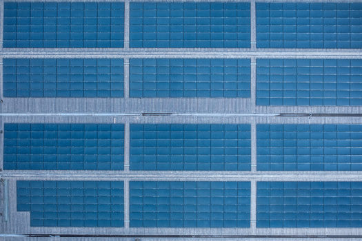 Aerial view of the blue storage units and industrial grid at the Irish Cement Ltd facility in Drogheda County Louth Ireland. Aerial view of the blue storage units and industrial grid at the Irish Cement Ltd facility in Drogheda County Louth Ireland.